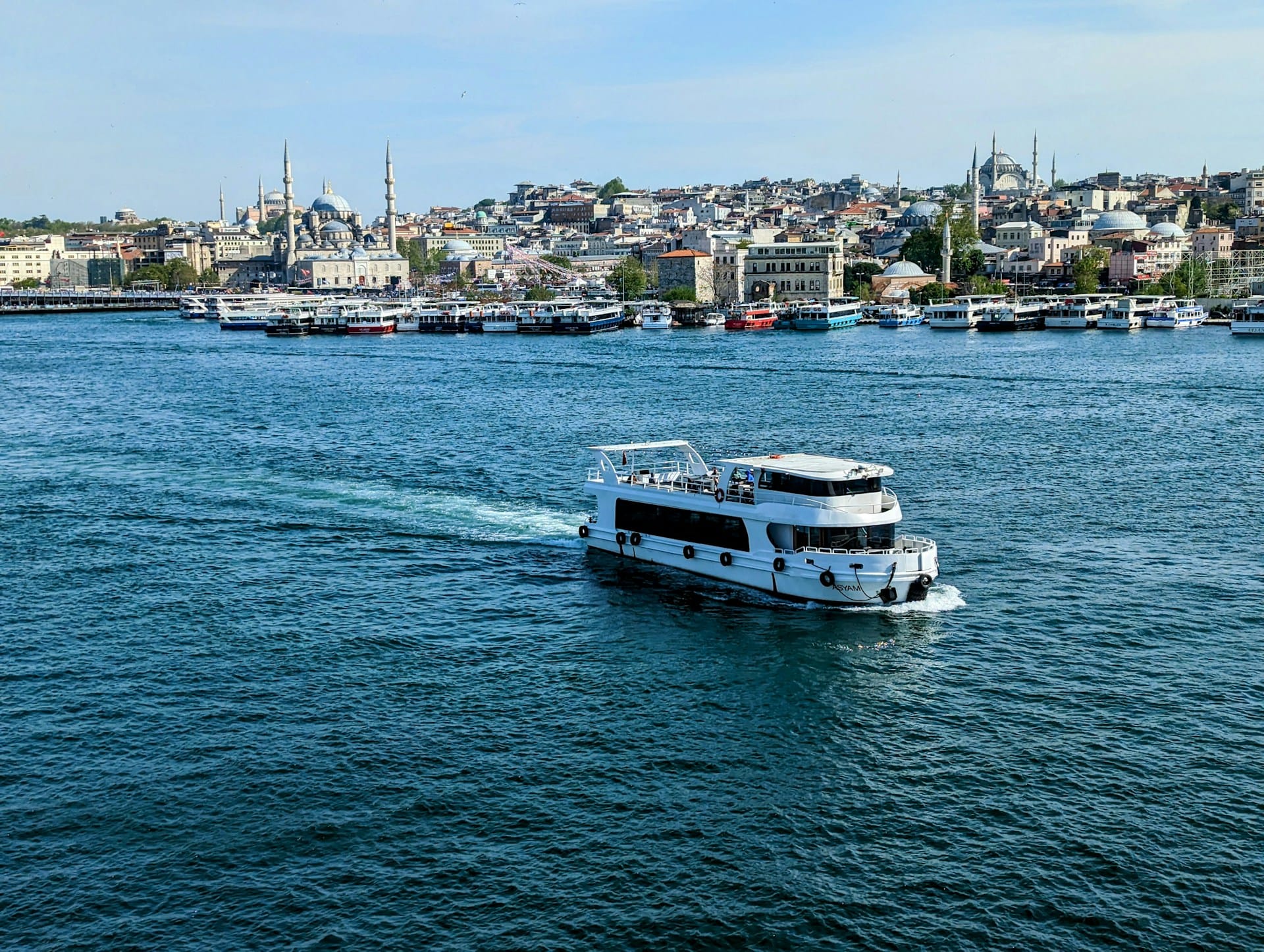 Expat holding Turkish residence permit card ikamet with Istanbul cityscape background