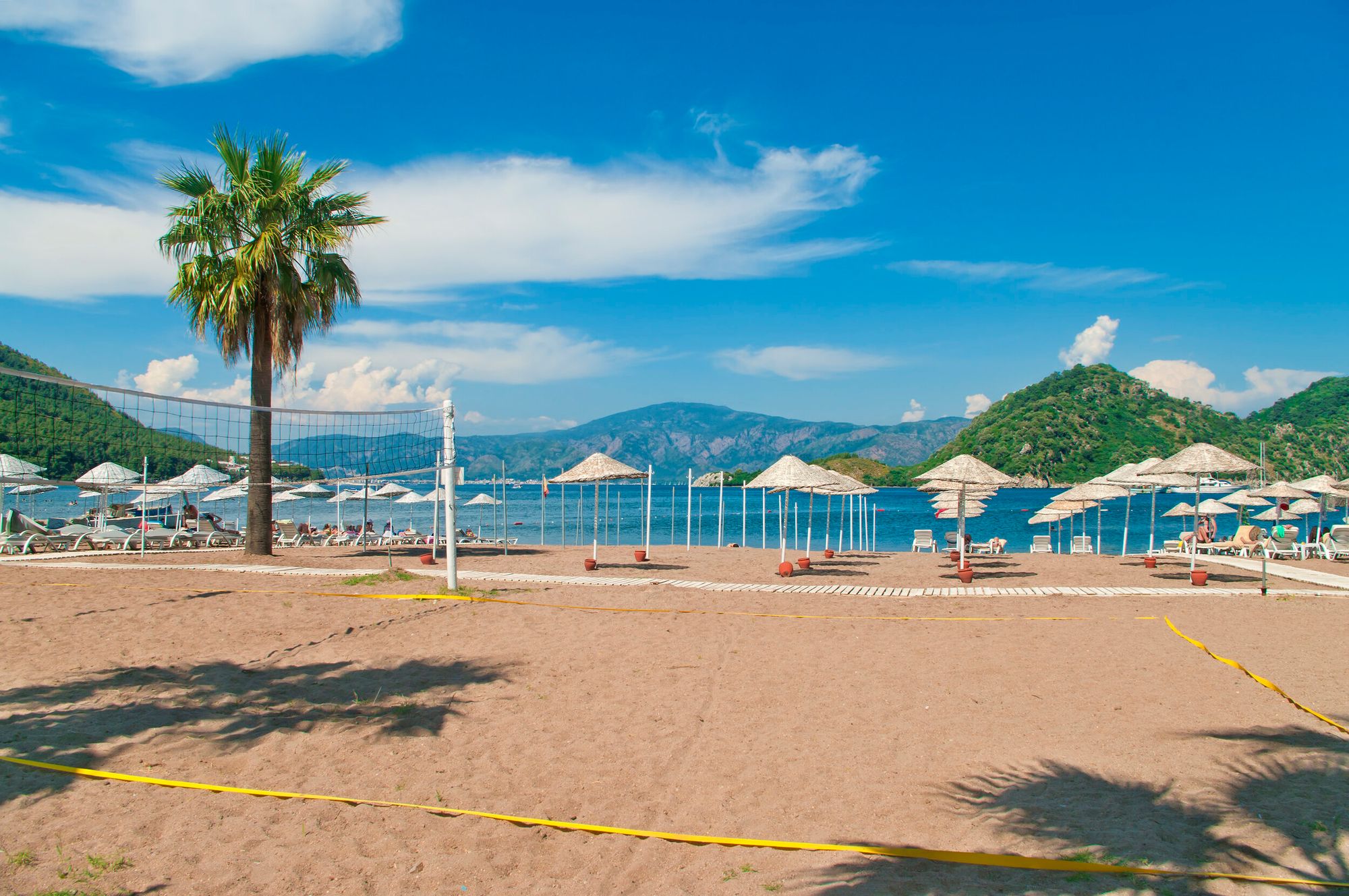 Beautiful Volleyball Court with Sunshades and Sunbeds on the Beach in Icmeler, Turkey – Getty Images